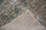 Faded Herati motif on distressed antique Persian Malayer runner pile and sturdy hand-knotted back.