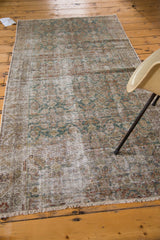 Distressed antique Malayer runner end, showcasing faded teal hues, worn texture, and fringe.