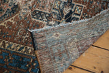 Distressed Karaja runner's hand-knotted foundation, fringed edge, brown and blue pattern.
