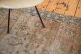 Visibly distressed Sivas rug showcasing faded rose blush, peach, and blue tones.