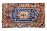Vintage Hamadan style rug runner with brilliant cobalt blue hexagonal medallion and geometric bronze-ivory patterns.