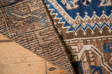 Vintage Hamadan rug, showing hand-knotted pile, woven backing, cobalt blue and brown motifs.