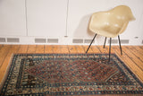 Vintage Persian Malayer rug corner, brick red boteh patterns, blue and ivory floral border.