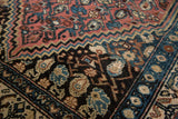 Hand knotted Malayer rug: brick red boteh field transitions to a dark floral border.