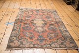 Vintage Kerman rug coral field with light blue floral arrangements and curvilinear border.