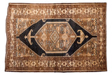 Vintage Persian Sarab rug with bold hexagonal medallion and rams horn lanterns in dark blue-black and bronze, 4.5x6.5 feet.