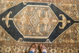 Serrated hexagonal medallion with rams horn lanterns in bronze, ivory, dark blue-black.