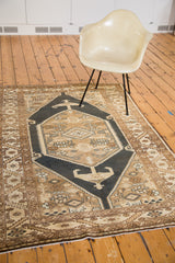 Vintage Sarab rug corner with serrated leaf border and dark blue-black rams horn motif.