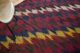 Dynamic diagonal zig-zag motif on vintage Kilim in mustard, indigo, and wine red.