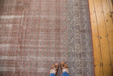 Faded red distressed vintage Oushak carpet, subtle boteh pattern, slate blue ivory border.