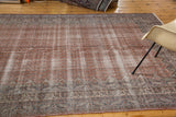 Distressed Oushak carpet corner with faded blush red pile, antique ivory, and slate blue border.