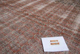 Distressed Oushak carpet pile showing faded blush red, antique ivory, and slate blue.