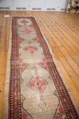 Distressed Persian Hamadan runner, geometric medallion, blush and time-softened green.