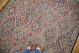 Vintage Jijim carpet with repeating rectilinear geometric lattice design in faded blush and slate blue.