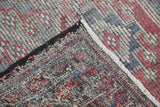 Vintage Jijim carpet's geometric weave, secure edge, and colorful hand-knotted foundation.