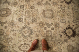Vintage Mahal carpet with Harshang design, dusty grey, earth tones, showing even wear and boots.