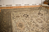 Vintage Mahal carpet showing Harshang design in wooded tones on dusty grey with even wear.