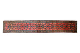 Vintage Persian Lilihan runner rug with a raspberry red field and allover floral bouquets.