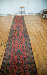Hand knotted Vintage Lilihan runner with a repeating madder red floral bouquet field.