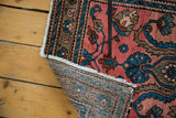 Hand-knotted Lilihan rug with raspberry field, revealing detailed construction and floral design.