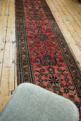 Persian hand-knotted Lilihan runner, raspberry field with slate blue and caramel floral bouquets.