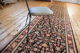 Fine Herati and Henna plant motifs in coral, navy, and ivory on antique Karabagh runner.