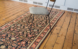 Traditional antique Karabagh runner showing navy Herati pattern and coral, ivory border.