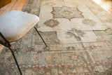 Oushak carpet border, geometric patterns, minor medallion, slate, blush, wooded tones.