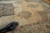 Vintage Oushak rug close-up showing hand-knotted pile and serrated medallion in wooded tones.