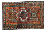 Vintage Karaja rug, geometric medallion, Laleh Abassi design, rich rust, green, and blue tones.