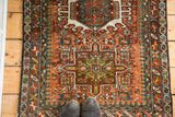 Karaja rug detail: Laleh Abassi pawn design border, with pea green and rust motifs.