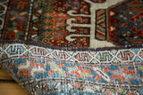 Vintage Karaja rug's securely bound edge and colorful hand-knotted reverse.