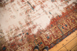 Antique Distressed Heriz carpet showing heavily worn pile with visible foundation.