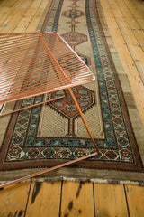 Playful asymmetric diamond medallion of vintage Serab runner with teal, rust, and ivory.
