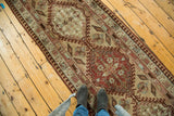 Implied movement in a vintage Serab runner with geometric medallions and expressive leaves.