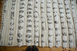 Moroccan handira wedding blanket's textured pile, plain weave, and scattered silver sequins.