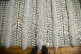 Alternating texture of thick pile and sequined chevron pattern on Moroccan wedding blanket.