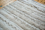 Textured Moroccan wedding blanket featuring alternating cotton white pile and scattered silver sequins.