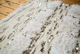 Vintage Moroccan wedding blanket with alternating ivory pile, plain weave, and silver sequins.