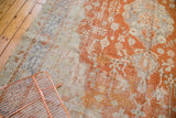 Soft rust orange, pale slate blue, and ivory curvilinear motifs on vintage Oushak rug.
