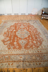 Vintage Oushak rug border, rust orange and pale gray floral motifs, with fringe.