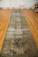 Distressed Vintage Kars runner's geometric medallion, with ivory, brown, and celadon green.