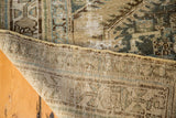 Distressed vintage Kars runner in antique ivory and celadon green, revealing intricate weave.