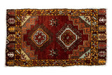 Vintage Oushak rug with dual geometric medallions, saffron border, and copper field, 1'7
