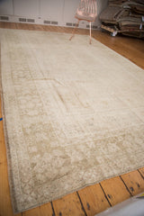 Vintage Oushak carpet corner, with subtle ivory, beige, and sage gold stepped spandrels.