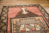 Hand knotted Oushak rug, blush and ivory floral motif framed by serrated coffee brown.