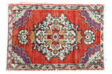 Vintage Oushak rug mat with intricate curvilinear and geometric medallion, cherry red, playful colors.