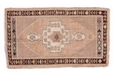 Vintage Oushak rug, hand knotted, with central medallion, pale camel field, and charcoal borders. 2x3'4