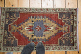 Secure fringe and geometric pattern details on a vintage Oushak rug corner.