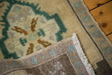 Secure white fringe and tightly hand-knotted reverse of a vintage Oushak rug.